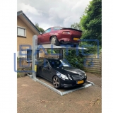 Dviejų kolonų parkingo keltuvas grindiniam šildymui
